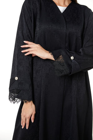 Black zeta jaquard Abaya featuring a soft woven feel